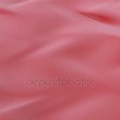 Abstract Red swirling liquid cloth motion seamless background