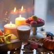 Cup of coffee, pumpkin, gifts and candles